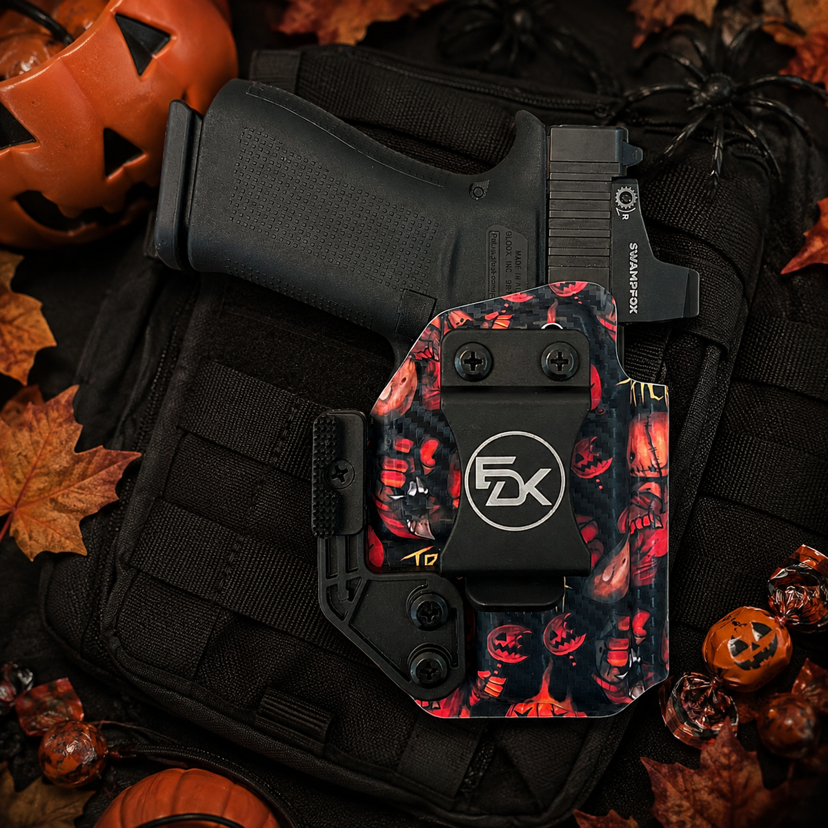Fits Glock 43X Trick or Treat IWB holster with Halloween pumpkin print, displayed with jack-o’-lanterns and trick-or-treat candy.